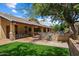 Backyard patio area, bar, and BBQ at 8272 S Pecan Grove Cir, Tempe, AZ 85284