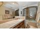 Bathroom with tile counters, sink, and walk-in shower at 8272 S Pecan Grove Cir, Tempe, AZ 85284