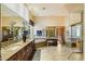 Luxurious primary bath features granite counters, soaking tub, vanities, and a large glass-enclosed shower at 8272 S Pecan Grove Cir, Tempe, AZ 85284