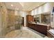 Spacious primary bath with granite shower, dual sinks, vanity, and a large walk-in closet at 8272 S Pecan Grove Cir, Tempe, AZ 85284