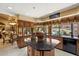 Spacious kitchen with a center island, black countertops, and custom cabinets at 8272 S Pecan Grove Cir, Tempe, AZ 85284