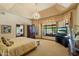 Spacious main bedroom with a chandelier, sitting area, and large windows at 8272 S Pecan Grove Cir, Tempe, AZ 85284