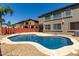 Sparkling backyard pool with a large patio area, perfect for relaxing or entertaining at 1051 E Julie Ave, San Tan Valley, AZ 85140