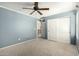 Inviting bedroom with a closet and ceiling fan, creating a serene living space at 1051 E Julie Ave, San Tan Valley, AZ 85140