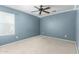 Comfortable bedroom with a window and a ceiling fan for a relaxing atmosphere at 1051 E Julie Ave, San Tan Valley, AZ 85140