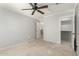 Cozy bedroom with a view to hall and ceiling fan for optimal comfort at 1051 E Julie Ave, San Tan Valley, AZ 85140