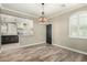 Dining area with views of the kitchen featuring white cabinets and stainless steel appliances at 1051 E Julie Ave, San Tan Valley, AZ 85140