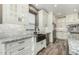 The kitchen showcases white cabinets, a granite countertop, and stainless steel appliances at 1051 E Julie Ave, San Tan Valley, AZ 85140