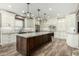Spacious kitchen featuring a large center island, stainless steel appliances, and custom cabinetry at 1051 E Julie Ave, San Tan Valley, AZ 85140