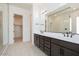 Modern bathroom featuring double sinks and a glass walk-in shower at 1336 E Cherrywood Pl, Chandler, AZ 85249