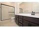 Bathroom featuring a glass-enclosed shower and a vanity at 1336 E Cherrywood Pl, Chandler, AZ 85249