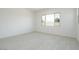 Bright bedroom with light wood-look floors and a large window at 1336 E Cherrywood Pl, Chandler, AZ 85249