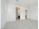Open bedroom featuring wood-look floors and access to bathroom at 1336 E Cherrywood Pl, Chandler, AZ 85249