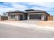 Modern home with desert landscaping, multiple-car garage, and neutral color palette at 1336 E Cherrywood Pl, Chandler, AZ 85249