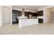Spacious kitchen featuring a large center island, stainless steel appliances, and dark cabinetry at 1336 E Cherrywood Pl, Chandler, AZ 85249