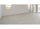 Bright living room with sliding glass doors and tile floors throughout at 1336 E Cherrywood Pl, Chandler, AZ 85249