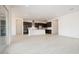 Open-concept living room with tile floors connecting to the kitchen at 1336 E Cherrywood Pl, Chandler, AZ 85249