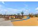 Large playground featuring climbing walls, rope structures, and accessible play areas at 1380 W Ridge Rd, Apache Junction, AZ 85120