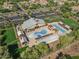 Aerial view showcases pool and recreation area with lush trees at 14640 W Dahlia Dr, Surprise, AZ 85379