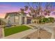 Charming single-story home with well-manicured lawn, beautiful brick driveway, and neutral stucco exterior at 14640 W Dahlia Dr, Surprise, AZ 85379