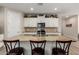 Modern kitchen with granite counters, white cabinets, stainless steel appliances, and decorative backsplash at 14640 W Dahlia Dr, Surprise, AZ 85379