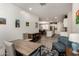 Open floor plan with dining area, shiplap wall, and an island in the kitchen at 14640 W Dahlia Dr, Surprise, AZ 85379