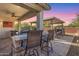 Outdoor kitchen featuring a built-in grill and bar area perfect for entertaining in a covered patio at 14640 W Dahlia Dr, Surprise, AZ 85379
