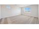 Bright bedroom features neutral walls, plush carpeting, and multiple windows that let in plenty of natural light at 14739 W El Cortez Pl, Surprise, AZ 85387