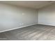 Neutral-toned bedroom featuring plush gray carpeting and plenty of natural light at 15911 W Montana De Oro Dr, Surprise, AZ 85387
