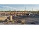 Exterior photo of a community bridge with metal railing and rock landscaping at 15911 W Montana De Oro Dr, Surprise, AZ 85387