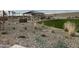 Outdoor picnic area with grill and seating surrounded by desert landscaping and green space in a desirable community at 15911 W Montana De Oro Dr, Surprise, AZ 85387