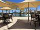 Community pool featuring shaded seating and playful water features, creating a fun aquatic environment at 15911 W Montana De Oro Dr, Surprise, AZ 85387