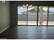 Bright dining area with modern chandelier and a sliding glass door to the backyard at 15911 W Montana De Oro Dr, Surprise, AZ 85387