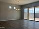 Open dining area with modern lighting and sliding glass doors to the backyard, perfect for entertaining at 15911 W Montana De Oro Dr, Surprise, AZ 85387