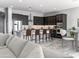Contemporary kitchen with dark cabinetry, stainless steel appliances, and a center island with seating at 15911 W Montana De Oro Dr, Surprise, AZ 85387