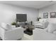 Inviting living room featuring neutral seating arrangements and stylish decor, perfect for relaxation at 15911 W Montana De Oro Dr, Surprise, AZ 85387