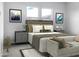 Comfortable main bedroom with a neutral color palette and ample natural light from the windows at 15911 W Montana De Oro Dr, Surprise, AZ 85387