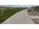 Winding pathway through the community with desert landscaping, green space, and walking trails at 15911 W Montana De Oro Dr, Surprise, AZ 85387