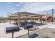 A picnic area featuring covered tables and barbecue grills, perfect for outdoor entertaining at 15911 W Montana De Oro Dr, Surprise, AZ 85387
