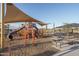 An extensive playground includes a slide and other features, complemented by picnic tables at 15911 W Montana De Oro Dr, Surprise, AZ 85387