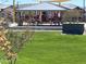 Shaded playground with slide and green lawn, perfect for activities at 15911 W Montana De Oro Dr, Surprise, AZ 85387