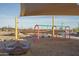 Swing into fun at the playground, complete with shade, seating, and a bridge in the background at 15911 W Montana De Oro Dr, Surprise, AZ 85387