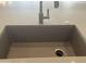 Close up of a kitchen sink with stainless steel faucet and grey stone countertop at 15911 W Montana De Oro Dr, Surprise, AZ 85387