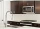 Gourmet kitchen featuring stainless steel appliances, white subway tile backsplash and gas range at 16077 W Remuda Dr, Surprise, AZ 85387