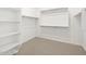 Spacious walk-in closet with shelving and hanging rods, ready to organize your wardrobe at 16077 W Remuda Dr, Surprise, AZ 85387