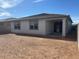 Backyard featuring a covered patio and a spacious area at 16080 W Prickly Pear Trl, Surprise, AZ 85387