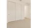 Bedroom featuring large sliding closet doors and a door leading to another room at 16080 W Prickly Pear Trl, Surprise, AZ 85387