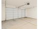 Spacious two car garage with automatic door opener and concrete flooring at 16080 W Prickly Pear Trl, Surprise, AZ 85387