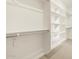 New walk-in closet with custom shelving and rod system at 16080 W Prickly Pear Trl, Surprise, AZ 85387