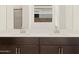 Bathroom featuring a double sink vanity, a large mirror, and tiled walls at 16081 W Remuda Dr, Surprise, AZ 85387